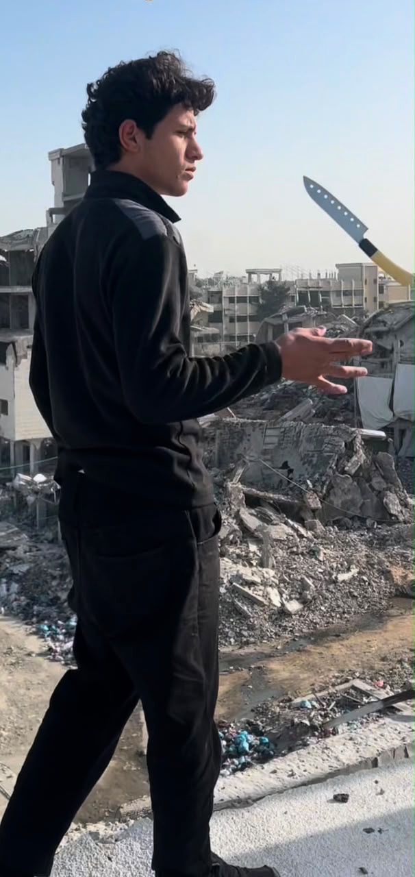 Anas juggling his chef's knife above the ruins of Gaza