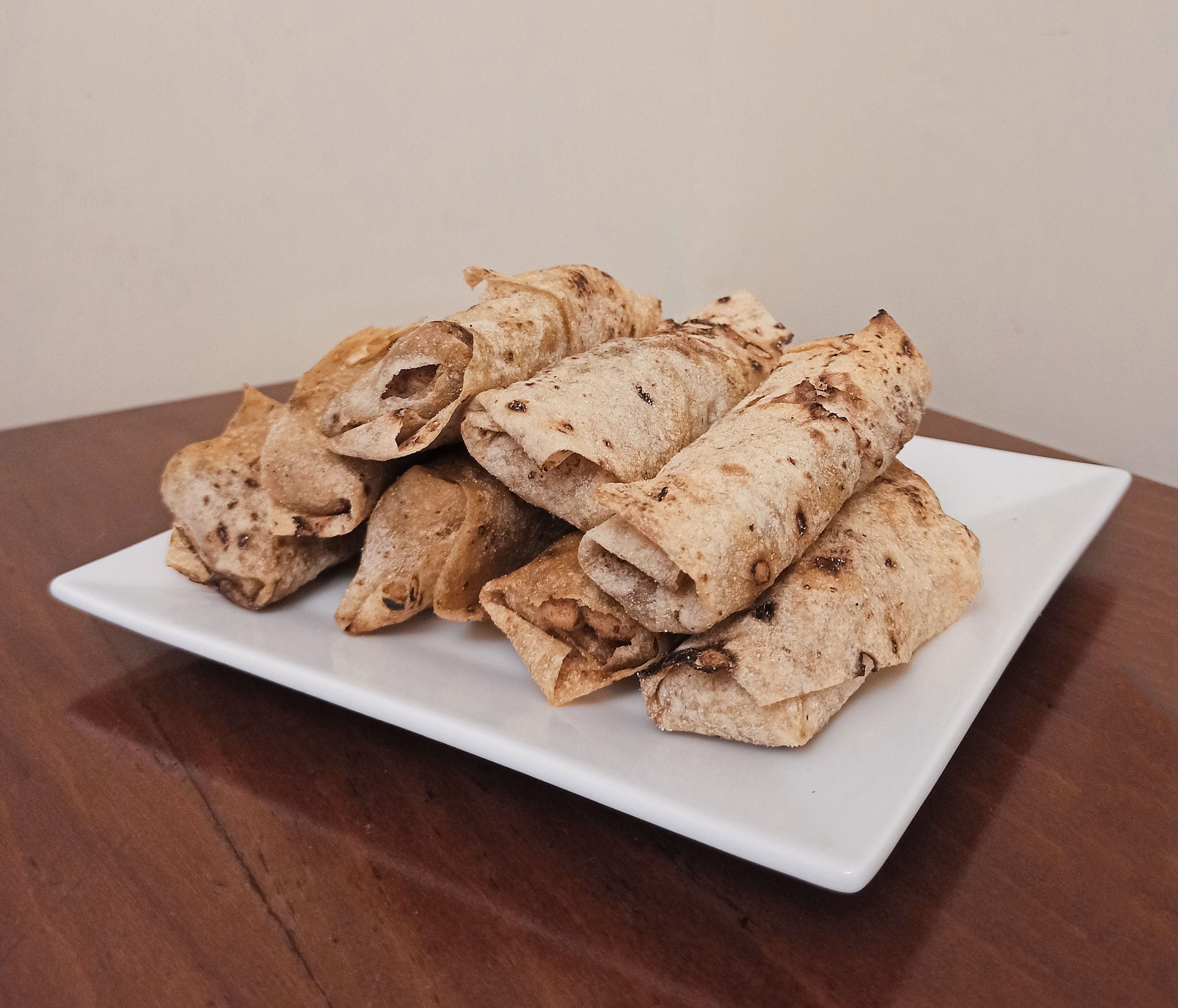 Palestinian Musakhan Rolls — Musakhan's sumac chicken and caramelized onions, wrapped and baked into crisp golden rolls.