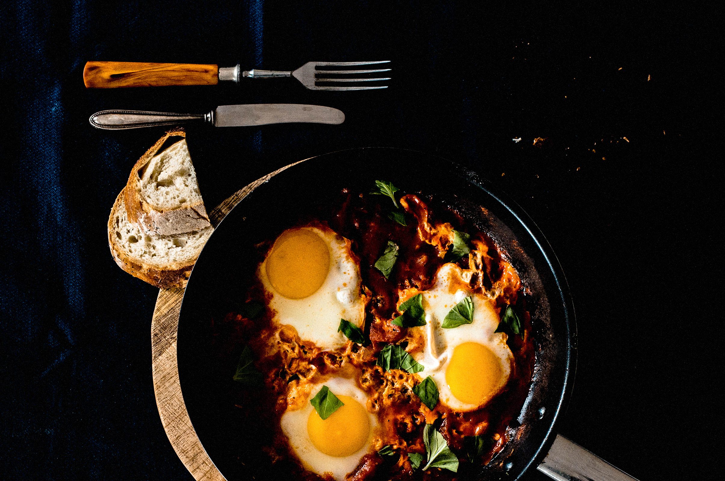 Palestinian Shakshuka — Palestine's most beloved breakfast — eggs poached in a rich, spiced tomato sauce with good olive oil.